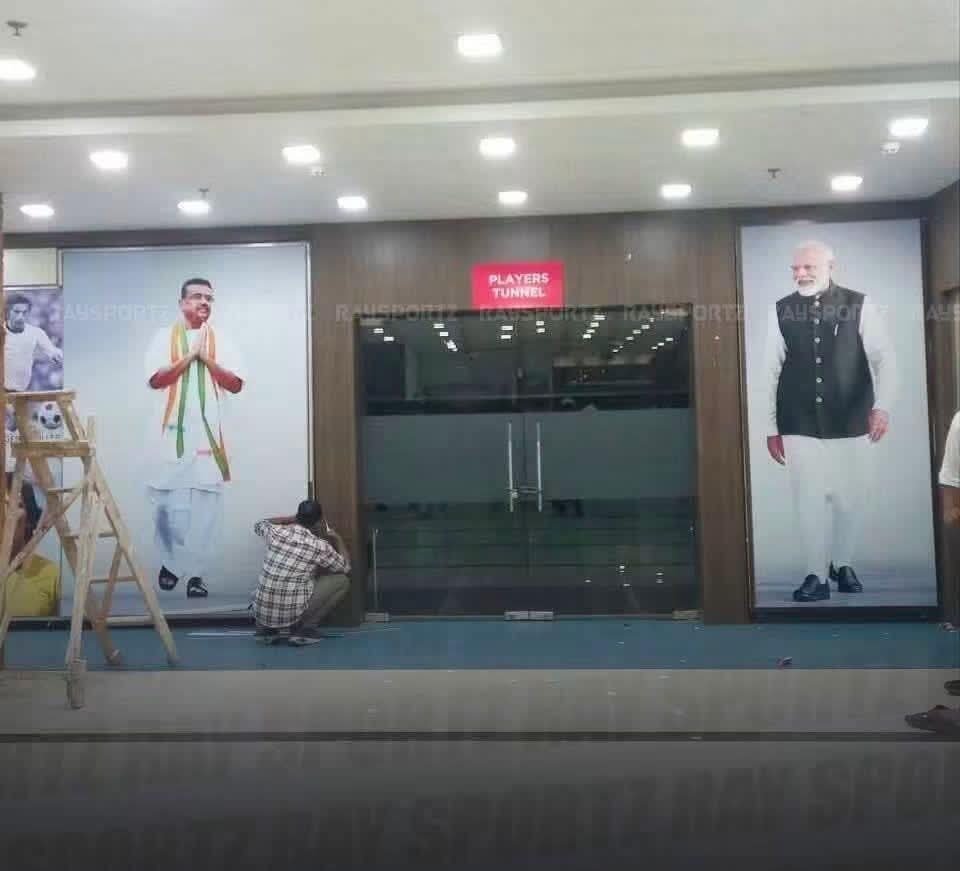 TheBengalCartel's tweet photo. If putting up pictures of these “football legends” beside the players’ tunnel wasn’t enough - A Brazilian journalist has now reported how their portraits were even displayed bigger than the players in the posters of India v/s Brazil match in Kolkata tomorrow 🤣 https://t.co/013JYteYRW