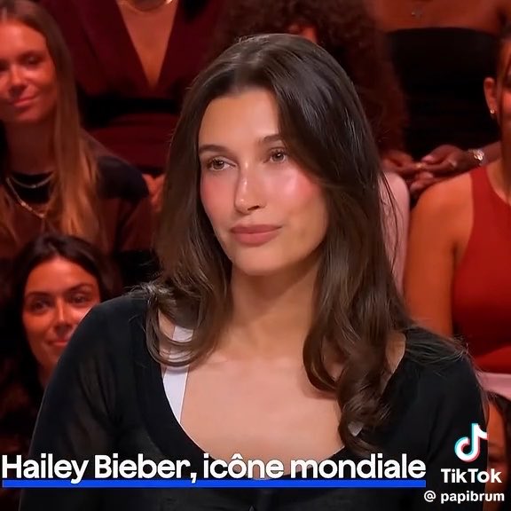 Hailey Bieber appears in a TV studio setting with text overlay reading "Hailey Bieber, icône mondiale" and a TikTok watermark from @papibrum.