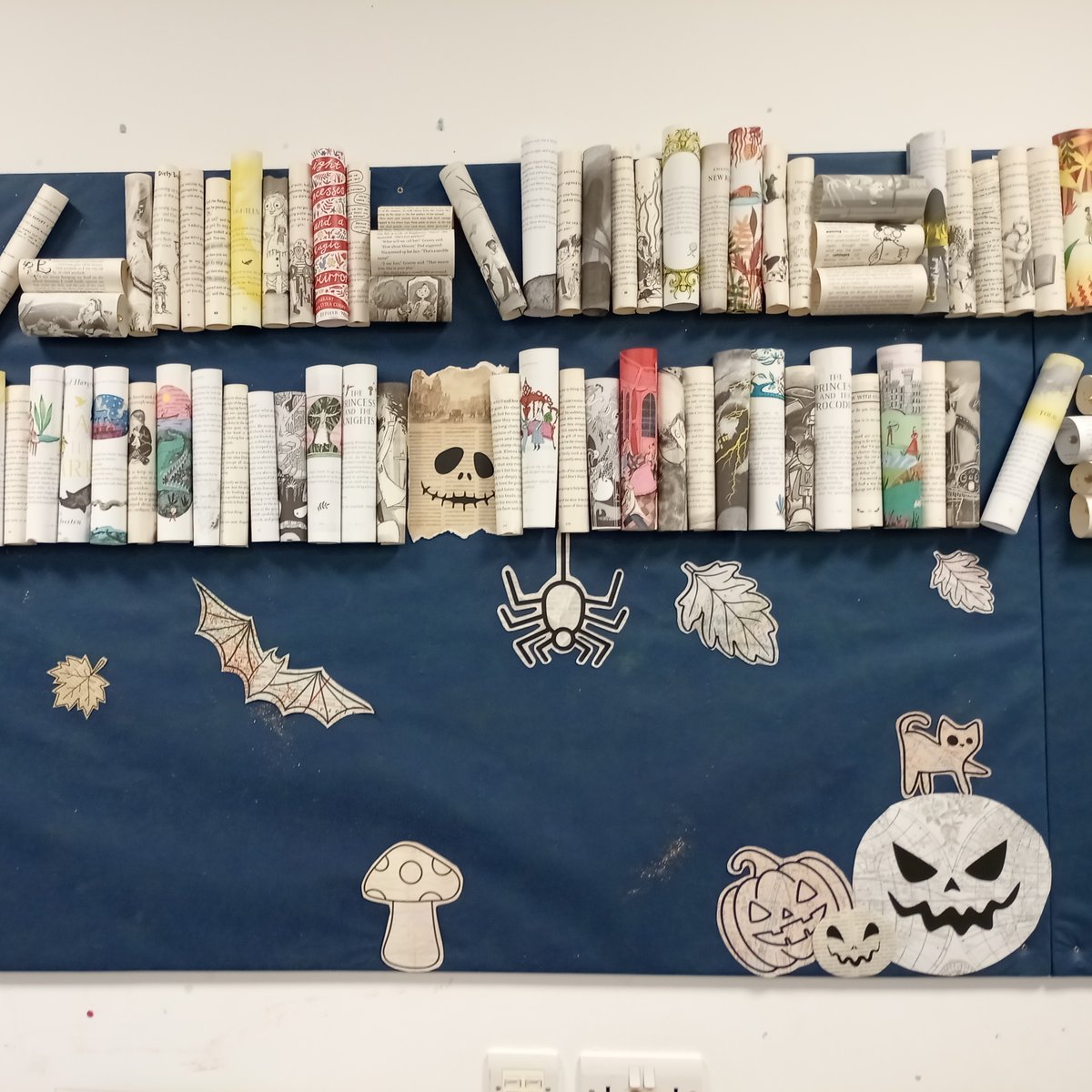 LibrariesNL's tweet photo. Have you spotted the wonderfully spooky displays in #CoatbridgeLib? Made by creatively upcycling much-loved old library books, they're sure to get you in the Halloween spirit! https://t.co/x2We0xe2nE
