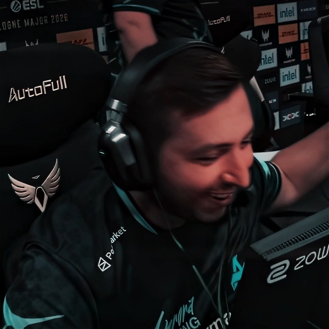 A bearded esports player wearing a black and teal jersey and large headphones smiles while raising his arms in celebration at the ESL One Cologne Major 2020 event, with visible sponsor branding including AutoFull, Intel, DHL, and ZOWIE. The image captures an exciting moment from the ESL tournament referenced by the "#ESLProLeague is BACK" caption.