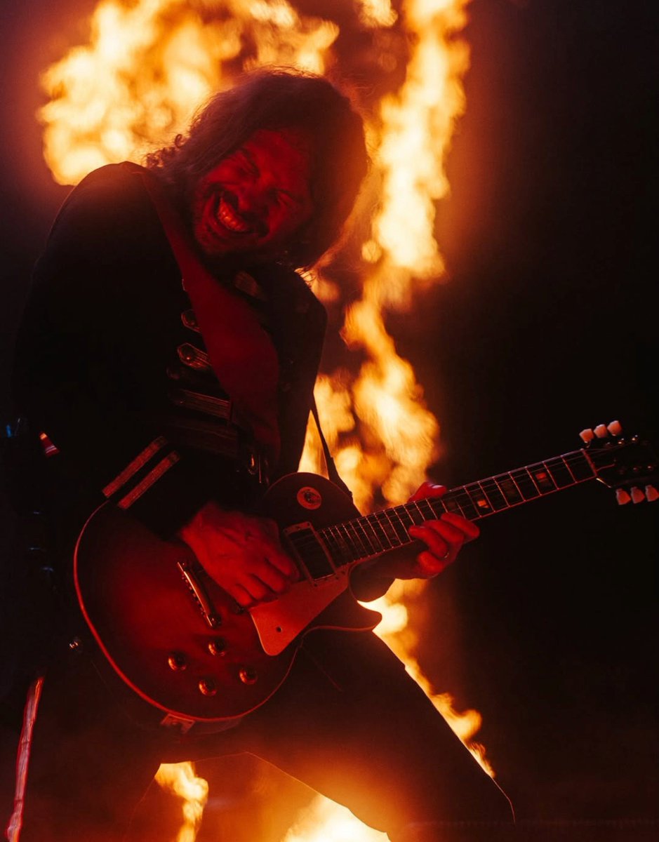SOTSPodcast's tweet photo. Ray Toro cast against a violent flame during My Chemical Romance's performance last night at Aftershock Festival.

📷 Steve Thrasher https://t.co/pzRHPMyCiL