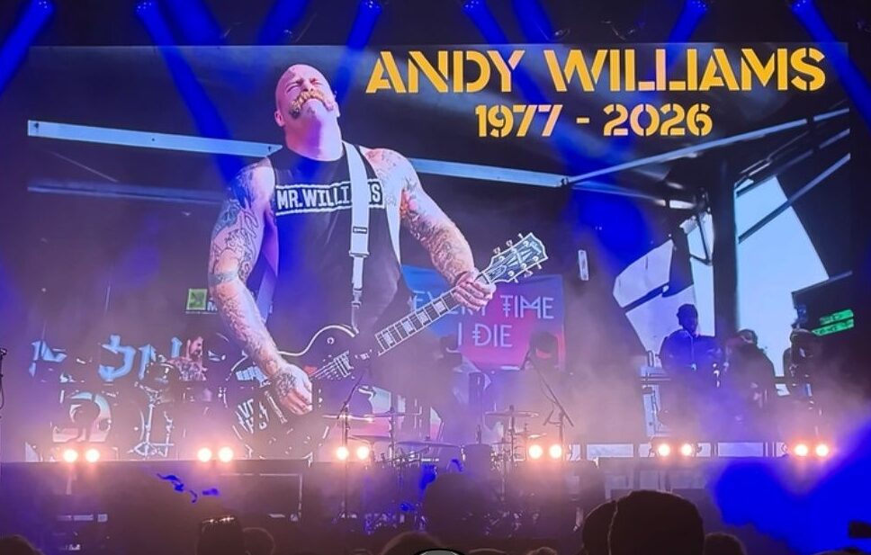 Fightful's tweet photo. Killswitch Engage remembers Andy Williams.

During the show at the Aftershock Festival in Sacramento, California.  A graphic for Williams was shown on stage, paying tribute to his passing in September. https://t.co/0oQ52TXADA