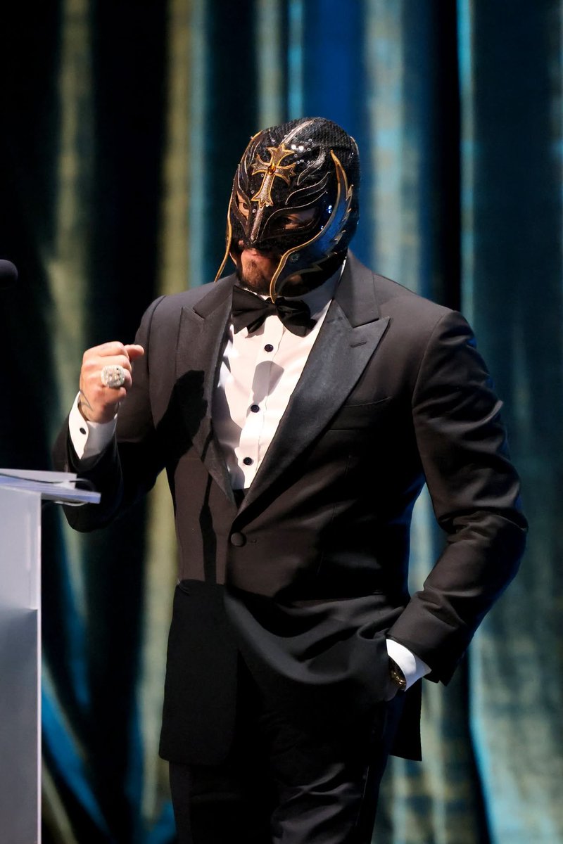 Complex's tweet photo. Rey Mysterio without his mask still feels illegal. 

Dragon Lee posted a photo of the WWE legend completely unmasked on IG, wearing glasses and a Mysterio shirt while posing together at a gym. https://t.co/0msS8Rucec