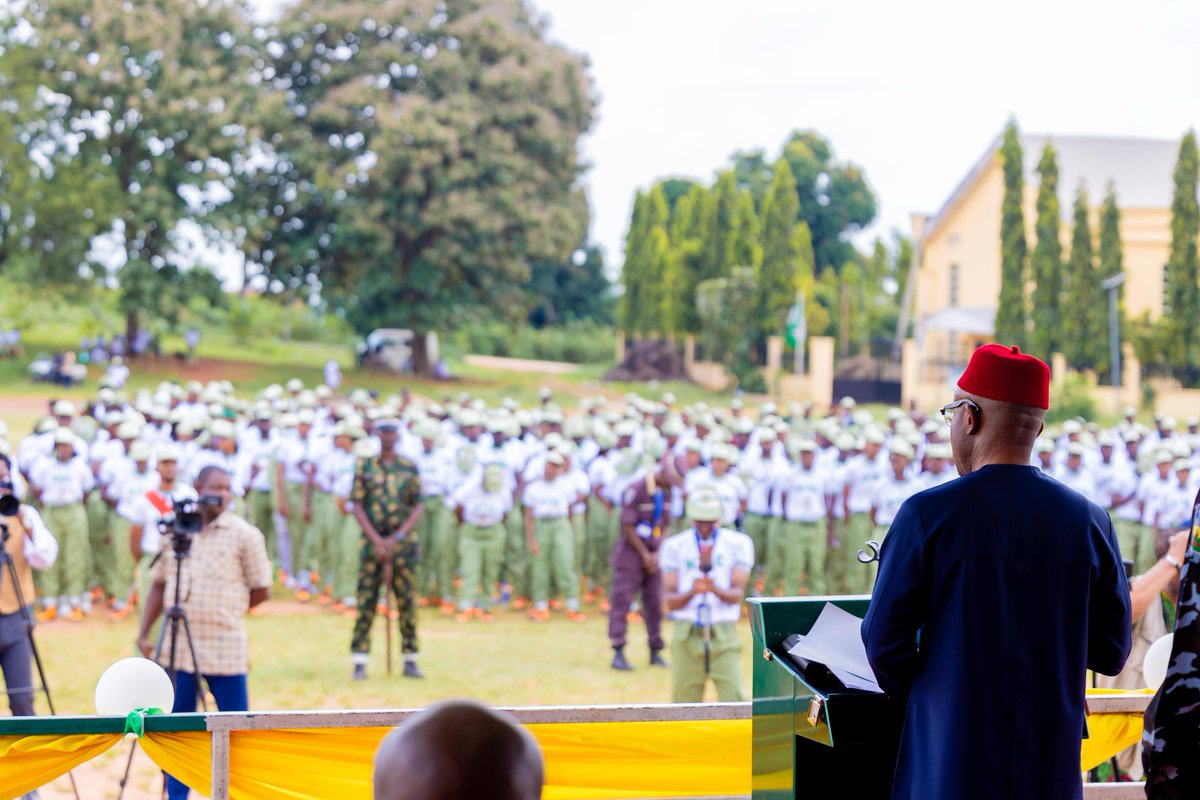 DanNwomeh's tweet photo. NEW: Governor Mbah canvasses a nation that earns patriotism of the youth, makes ‘japa’ a choice

...As 2,101 corps members are sworn in in Enugu State

Governor of Enugu State, Dr. Peter Mbah, has charged Nigerians with collectively building a nation that earns the patriotism of young people, while also making migration a choice, not an escape route.

Mbah spoke in Awgu during the swearing-in ceremony for the 2026 Batch C Stream of the National Youth Service Corps (NYSC) members deployed to Enugu State.

He stressed that Nigeria’s extraordinary youth population could only become a demographic dividend if the nation creates the education, skills, jobs, enterprise and institutions that enable young Nigerians to convert their energy and talent into productivity and prosperity, hence the essence of the NYSC beyond experiencing other parts of Nigeria.

“We often ask young Nigerians to be patriotic. But let us ask ourselves a more difficult question: How do we earn the patriotism of our young people if they feel excluded from their country's promise?

“Patriotism must be cultivated by creating a country in which young people can see a future for themselves.

“We must provide quality education; create an enabling environment for enterprise; expand opportunities; make our institutions work.

“We must build a country where merit is rewarded, hard work has meaning and dreams do not have to be exported before they can become reality,” he said.

Mbah, however, urged the youth to never forget the demands patriotism makes of them, both in good and difficult times.

“Patriotism also demands something from you. It demands that, even when the country is imperfect, you refuse to give up on its possibilities; that you criticise what is wrong without abandoning what can be made right; that you do not merely ask: ‘What can Nigeria give me?’

“but also ask: ‘What can I give Nigeria?’

“Together, we can build a country where ‘japa’ is a choice, not an escape; where our young people can travel the world without feeling compelled to abandon home.

“If you are called upon to teach, teach as though Nigeria’s future were sitting before you – because it is. And when you encounter the difficulties, do not simply ask: ‘When will Nigeria change?’ Ask the more powerful question: ‘What can I do to change Nigeria?’ That is the question of citizenship,” he emphasised.

He assured them of their welfare, safety and comfort in Enugu State, reminding them that Enugu is a state rich in cosmopolitan history, and where every citizen could attain any height he or she is capable of.

“The Government of Enugu State will continue to work with the NYSC authorities to provide a conducive, secure and supportive environment for your service. We will pay particular attention to your welfare, safety and the conditions under which you discharge your responsibilities across the state.

“But, importantly, note that you are not strangers in Enugu. Our history offers remarkable testimony. When Enugu was elevated to municipal status in 1952, Mallam Umaru Altine, a Fulani man from Sokoto, became its first Mayor.

“It tells us that in Enugu, where you come from need not determine how far you can go; that belonging is not always about birthplace; that citizenship is also about contribution,” he assured them.

Speaking earlier, the NYSC State Coordinator, Mrs. Oluwakemi Awolola, on behalf of the Director-General of the agency, Brigadier-General Olakunle Nafiu, said a total of 2,101 corps members had been registered under Batch C, and thanked Governor Mbah for improved welfare of Corps members and for making their environment conducive and safe.

“I am pleased to report that a total of 2,101 prospective corps members, comprising 983 males and 1,118 females, have been successfully registered for the 2026 Batch ‘C’ Stream/Orientation Course in Enugu State. Their level of cooperation, enthusiasm, and willingness to participate in camp activities have been commendable.

“We remain