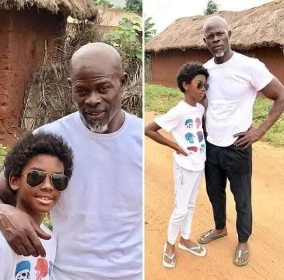 historical_Afr's tweet photo. With all his success in Hollywood and superstar status, Djimon Hounsou still visits his village in  Benin Republic 🇧🇯 with his kid. https://t.co/hmIiiOPCes