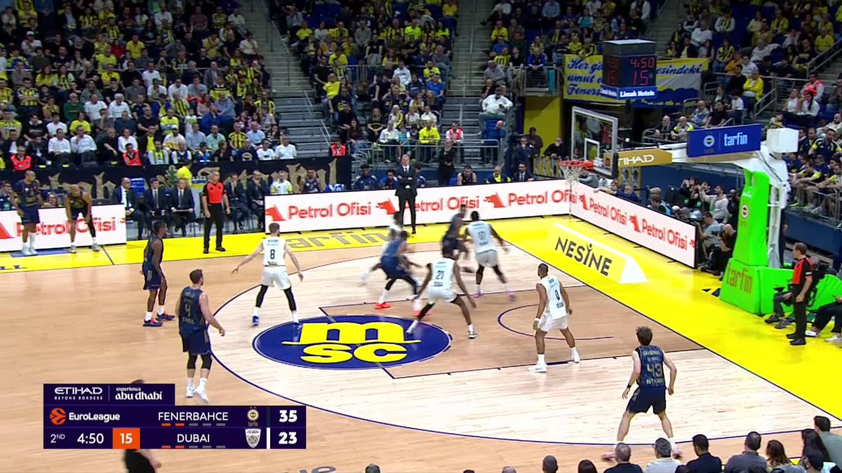 Fenerbahçe leads Dubai 35-23 with 4:50 left in the 2nd quarter of a EuroLeague game at Ülker Sports Arena, as players scramble for position near the basket on the MSC-branded court. The Turkish caption references Marcus Bingham scoring for Fenerbahçe, aligning with the action shown near the hoop.
