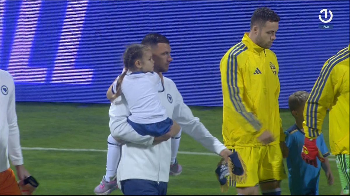 BHLiveOfficial's tweet photo. 🇧🇦💎 Edin Džeko walks out as captain one last time, with his daughter. 

You’re not crying, we are. :( https://t.co/uMbelraK2s