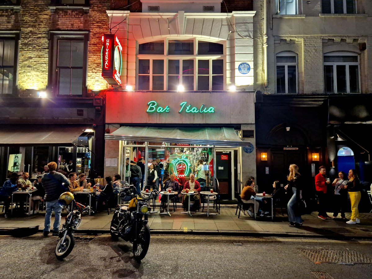 danbarker's tweet photo. Almost all changes in life, but there will always be a couple of guys sat outside Bar Italia, on any warm evening, watching the world pass by. https://t.co/fJwjJSx1Rj