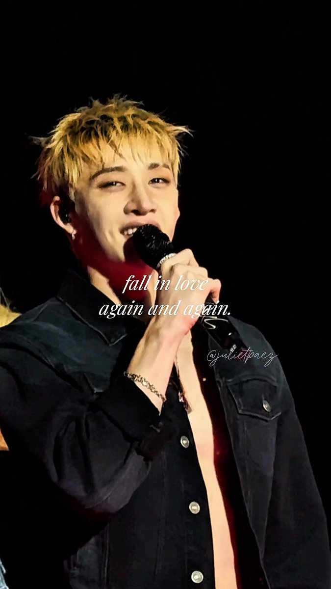 A performer with blonde hair sings into a microphone wearing a black denim jacket; overlaid text reads 'fall in love again and again.' with a watermark '@julietperez'.