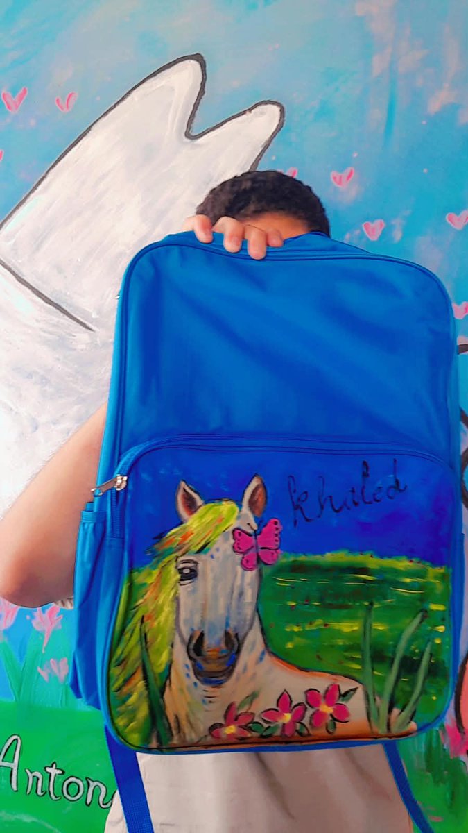 arabnews's tweet photo. As Gaza’s children return to school, local artists are painting aid-issued backpacks with rocket ships, princesses and horses, restoring a small sense of childhood. Read more: https://t.co/yhFievXXk5 https://t.co/96M3eUfbVu
