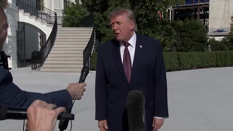 President Donald Trump, wearing a navy suit and red tie, speaks to reporters holding microphones outside the White House, addressing his decision not to authorize a diesel export ban following G7 countries' agreement to release diesel and crude oil from emergency reserves.