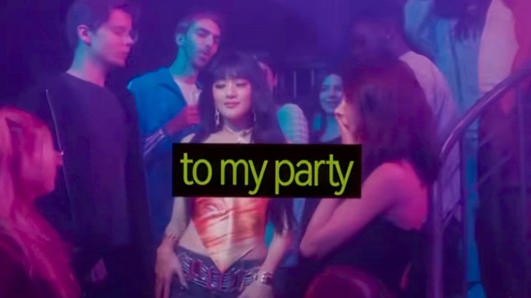 A woman in a red top stands in a dimly lit, neon-colored party scene with the text "to my party" displayed in bright green letters across the center.