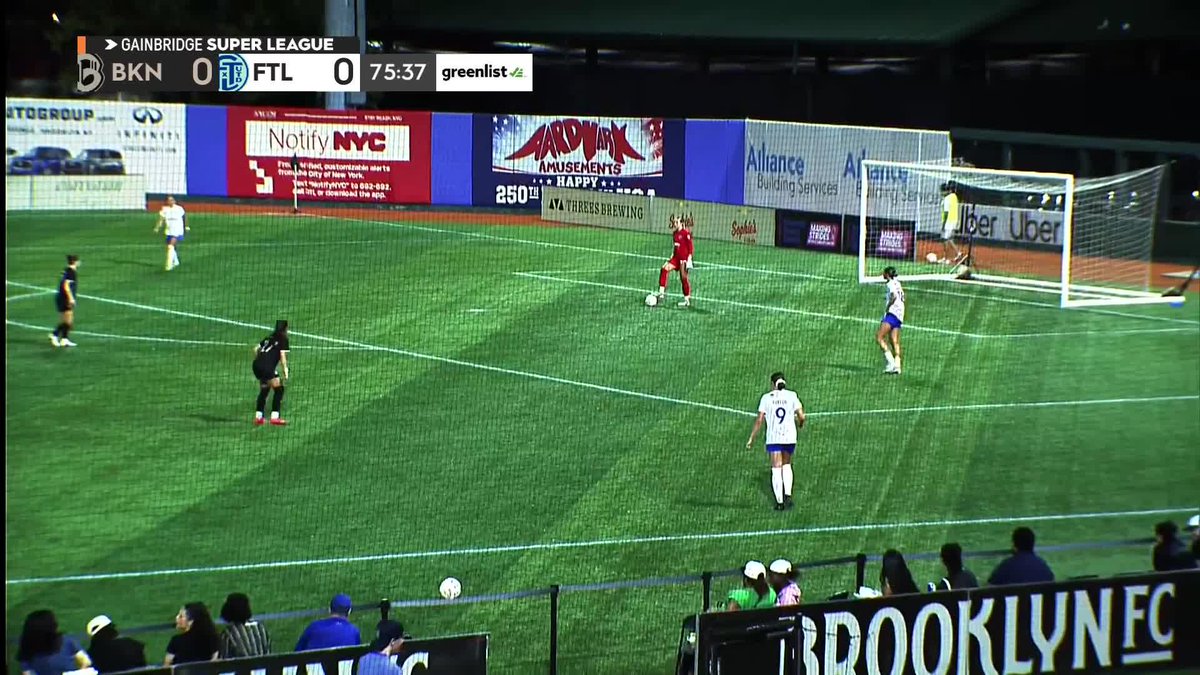 A Gainbridge Super League soccer match between Brooklyn (BKN 0) and Fort Lauderdale (FTL 0) at 75:37 is shown on a screen, with players on the field and a 'BROOKLYN EC' banner visible.