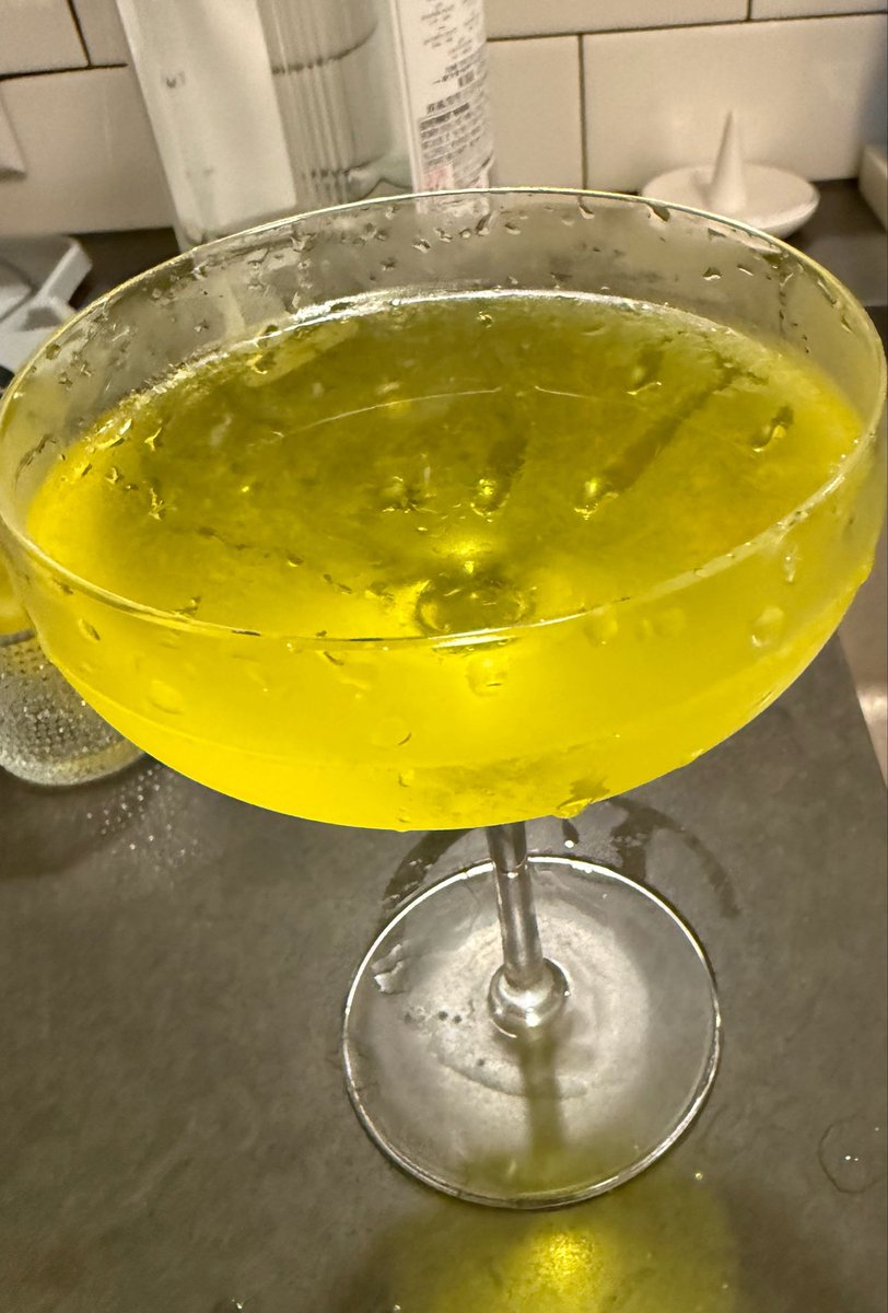 alexis_conrad's tweet photo. My fiance made the craziest fuck ass martini like excuse me, this looks like Mountain Dew how is this the best pepperoncini martini ive ever had https://t.co/3jYAAyrJMH