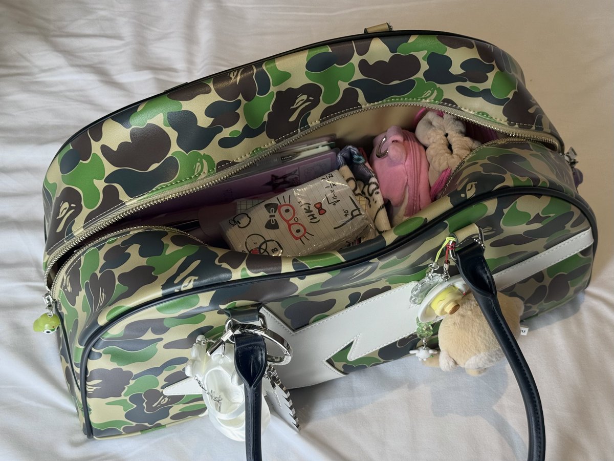 cakeshop's tweet photo. what's in my bag (and it's just pouches in it) https://t.co/fXn1pHeA0i