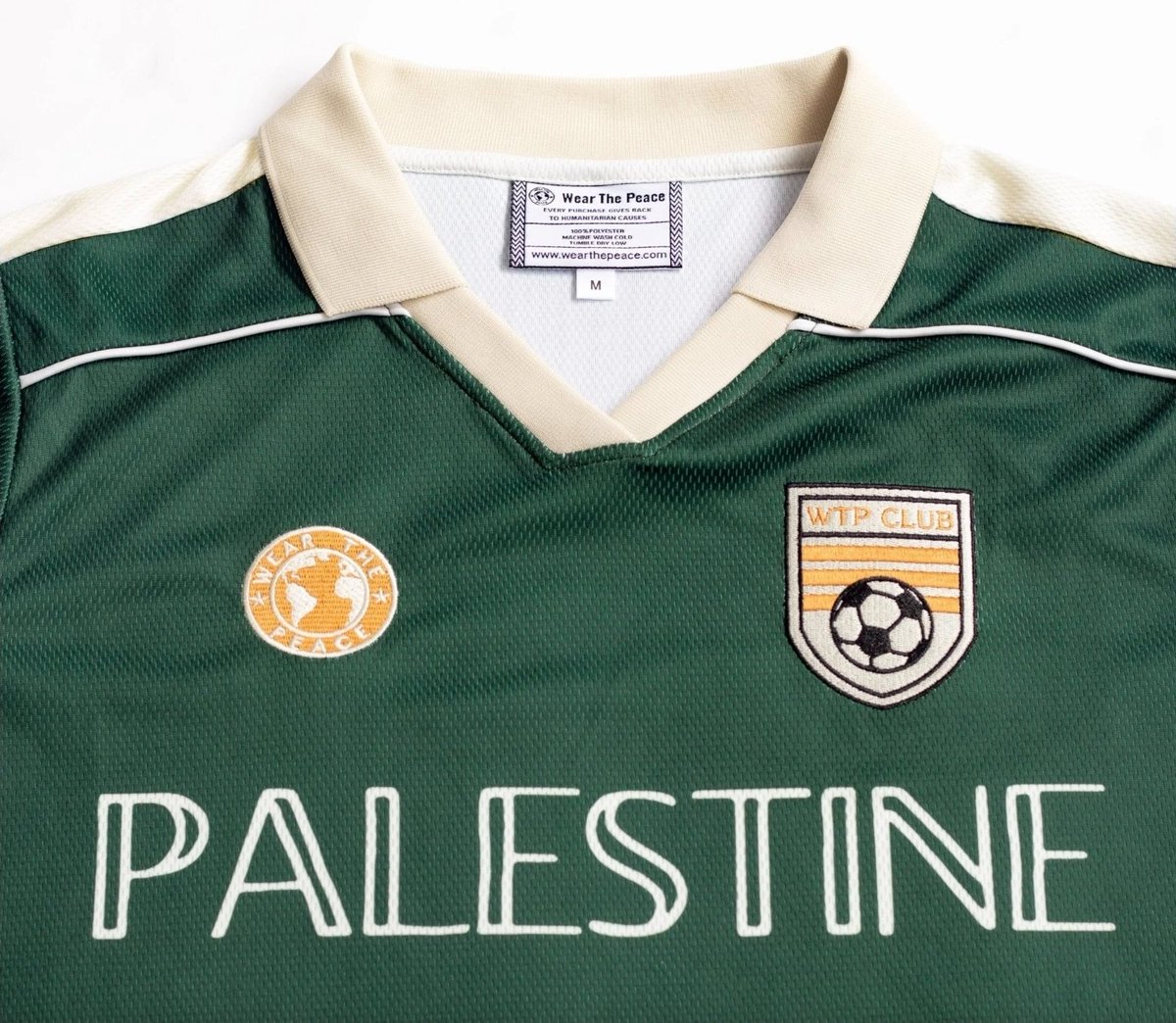 TheGroundIntel's tweet photo. Zach Bryan and members of his band, including his drummer and guitarist, took a defiant stand on October 2, 2026, by wearing "Free Palestine" and "Hind Rajab" shirts during their concert at Robert Kraft's Gillette Stadium. The Palestine Jersey worn by the guitarist, and Hind Rajab jersey worn by the drummer, are from Wear the Peace, a US based organization that donates profits to programs in Gaza.
@WearThePeaceCo