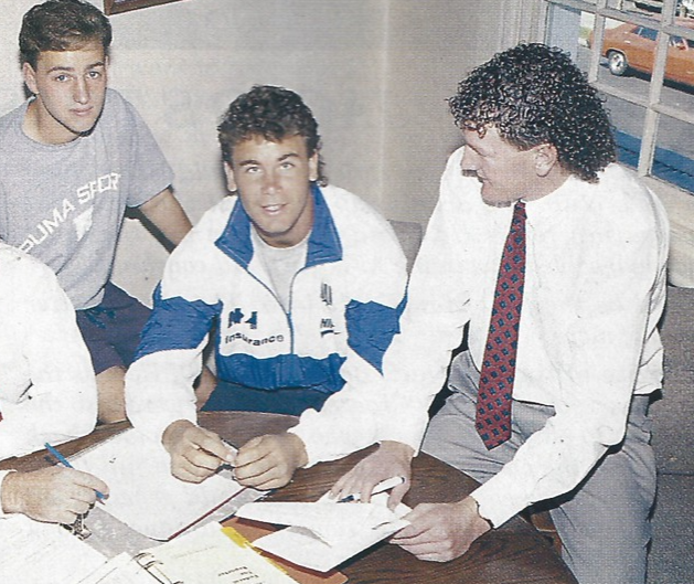 Demonblog's tweet photo. Here's Paul Trimboli, a half-cut looking Wayne Carey, and the other bloke about to sign somebody else's name on official memorabilia. #1994chat https://t.co/BedgLVdiNc
