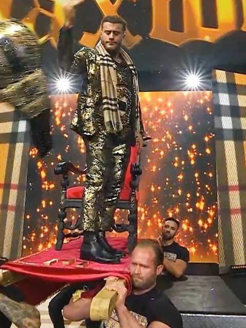 DFW_Wrestling's tweet photo. @MandlaNgannou @VincentCrossDFW @MKingsley_DFW's THEME HITS!

The camera cuts to the stage, where Miles Kingsley is being brought in onto the stage, on a special Red Throne, a massive smirk on his face. He jumps off, The Atlantic Championship rests on his waist. He storms to the ring. Ready to defend. https://t.co/FVsKP3PRHE