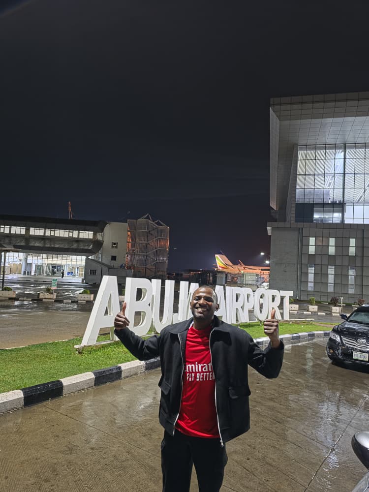 Victorokeke_'s tweet photo. How Someone Took My Bag At The Airplane in Abuja 

As soon as I left Incheon Airport and arrived in Dubai, the quiet peace of Korea vanished from the air around me. People no longer queued to board the airport shuttle bus. People no longer lined up to use the escalator or stayed only on the right side; some users stood in the middle with their carry-on luggage, blocking the whole aisle. 

At the boarding gate lounge for my connecting flight, a woman sat at the end playing a Christian song loudly from her phone, while a man a few seats away watched football highlights with the sound bleeding out enough for the quiet lounge to reflect it. The airplane was like a marketplace before it took off, full of chattering, loud reunions, and attempts at friendship with seatmates. This particular lady talked about how she was connecting from Malaysia and had lived a substantial number of years there; going to Nigeria now feels like a visit and not home. 

The flight was pleasant and eased us into the Lagos airport smoothly. I had a connecting flight to the east at 5:00 p.m. We arrived at 3:45 p.m., but I spent the next hour waiting for my luggage at the baggage claim section of the airport. When I finally claimed it, customs and immigration clearance was easy, and luckily, not many people begged or insisted that I give them money. 

I was charged ₦15,000 for a taxi from the international wing to the domestic wing of the airport. I arrived at the airline counter late; the flight was delayed, but they still could not let me check in. I eventually rebooked the ticket for a 6:45 pm Abuja flight. It was delayed by 50 minutes due to a delay caused by the late arrival of the aircraft. 

The waiting area was littered with water bottles, biscuit wrappers, apple remnants, and similar food items that one could buy at the airport. One of the airlines had earlier served food items to waiting passengers because of the delay in their own flight to another destination. Delayed flights were on everyone's lips. 

There is no way Nigerians today are among the happiest people on earth; everyone's face looks gloomy, dejected, or angry. Others are complaining, arguing, or making a faux show of rights they are not entitled to, while the rest are indifferent or locked into phone calls. 

Shortly after we prepared to board the aircraft, a woman arrived to clean the area with a lack of enthusiasm that suggested she might be overworked, underpaid or owed months of salary. 

The flight attendant responsible for the two rows near my seat, which happened to be the emergency exit, appeared quite stern and somewhat discourteous. Her instructions were delivered firmly, and her tone was strictly professional. The passenger beside me remarked that she would make an excellent head teacher, adding that it can be challenging to serve Nigerian generally, as many tend to disregard instructions. One man confronted her for touching his bag in the overhead locker, claiming it contained a laptop. She explained without apology that she was simply organizing the carry-on items to ensure the locker could accommodate more luggage. The exchange lasted several minutes, with both parties asserting their positions. Shortly thereafter, our flight departed for Abuja. 

The Air Peace flight to Abuja was peaceful; sitting above the weather, time seemed to slow down, and I fell asleep and saw myself in Abuja with only a deep, quiet peace and a sense of absolute freedom like a hero's return. It was raining at the airport. 

Then, the unimaginable happened: someone stole or mistakenly took my checked- in bag from the overhead luggage compartment, leaving their own behind. My bag contained all my personal effects—my passport, flight tickets, laptop, phone, books, other invaluable items, and the two iPhones Collins bought for his siblings in Enugu. 

I ran down the boarding staircase, but the person had disappeared even before the airport shuttle bus arrived to drive passengers to the terminal building. I reported it to the airport attendants and security, and they used their intercom to notify the exit gate and baggage inspection officers. The person evaded all these protocols and is already home. 

The flight attendant handed over the bag he left behind to airport security. The bag was inspected, and an MTN Nigeria staff identity card was found inside along with other items. The identity card provided the passenger's phone number, and he was contacted. He said it was a mistake caused by his hurried exit and travel fatigue. He arrived one hour later, by which time it was already 11:10 p.m. 

The taxi driver who took me home was full of cautionary and advisory stories. Everyone is afraid. Everyone is warning you about places not to go at night. Stories of armed robbery attacks and daytime betrayals of trust burdened his lips and sank my heart. 

In one of the stories, he said a man who had returned from overseas with his little children negotiated a taxi ride with a driver. The driver did not come down to help him put his luggage in the boot, which he said was understandable as the task force usually impounded non-union member vehicles picking up passengers at the airport. He remained in the driver's seat, and as soon as the luggage had been loaded, he drove off with it, leaving the man and his children behind. 

That was it. The father was left shouting for help, and no one seemed to understand what was even happening to him. It reminded me of the helplessness you face in Nigeria when you suddenly become a victim of robbery. No one around seems interested in what is happening to you, sometimes not even the police when they are at the scene. 

When my previous phone was stolen as I walked through the exiting crowd at the National Institute for Policy and Strategic Studies (NIPSS) in Jos, after the graduation ceremony of senior military and paramilitary officers and directorate-level civil servants, I shouted for help. Everyone was completely disinterested, as though there was nothing bizarre about what had just happened. 

The taxi driver said he had suspected that the other driver was a fraud from the moment he agreed to carry the man and his family for a terribly low fare of ₦15, 000 compared with the ₦25,000 he himself had quoted, which he considered a reasonable fare from the airport into Abuja city centre. 

The light at the end of this particular story was that he decided to pursue the fleeing driver in his empty vehicle. He tried several times to stop him, but there were no police checkpoints along the Lugbe Expressway. Eventually, however, he caught up with him in traffic on a service lane shortly after the driver entered the city.