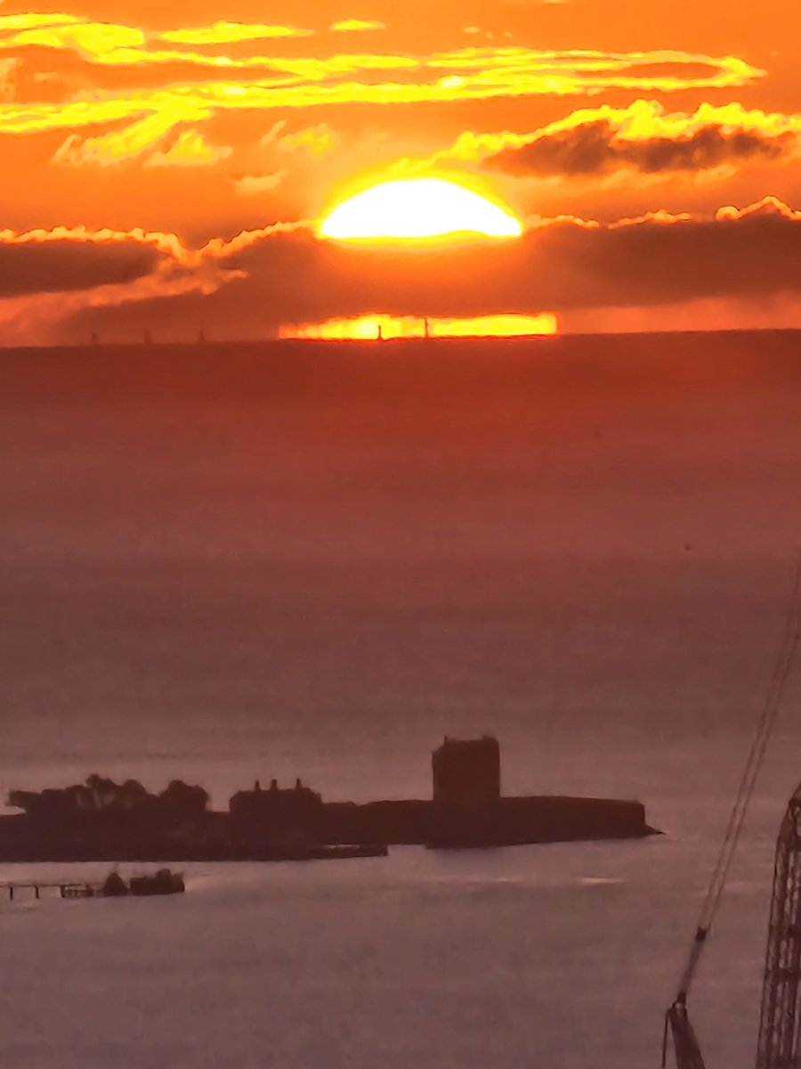 PaulVinova's tweet photo. Phone pic of Bell Rock Lighthouse in front of today's sunrise ~from Dundee Law 🌅 https://t.co/7iHaqbcCEs