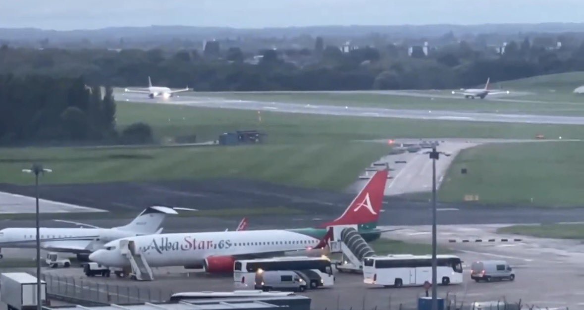 PatriotNetworkx's tweet photo. ⚠️ ALERT ⚠️

We now have footage of another private AlbaStar plane, this time in the cargo area of Birmingham airport.

The exit stairs are covered so whatever they are doing can't be seen.

What can be seen are the same private coaches that have been seen offloading migrants in Liverpool, Manchester and other places.

Although its possible these are migrants being deported, If the government was deporting entire plane loads of migrants, why aren't they screaming about it from the rooftops like they did when they deported a plane full of Brazilians?

@MrKnight2205 

https://t.co/Lp2bNurRX3