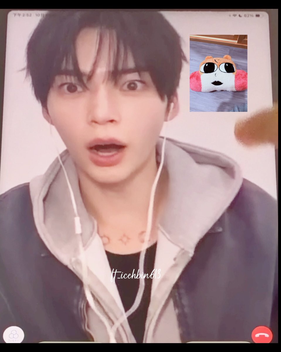 A screenshot of a video call shows a young man with dark hair wearing earphones and a hoodie, with the username 'Hicehbin613' visible and a small plush toy in the corner.