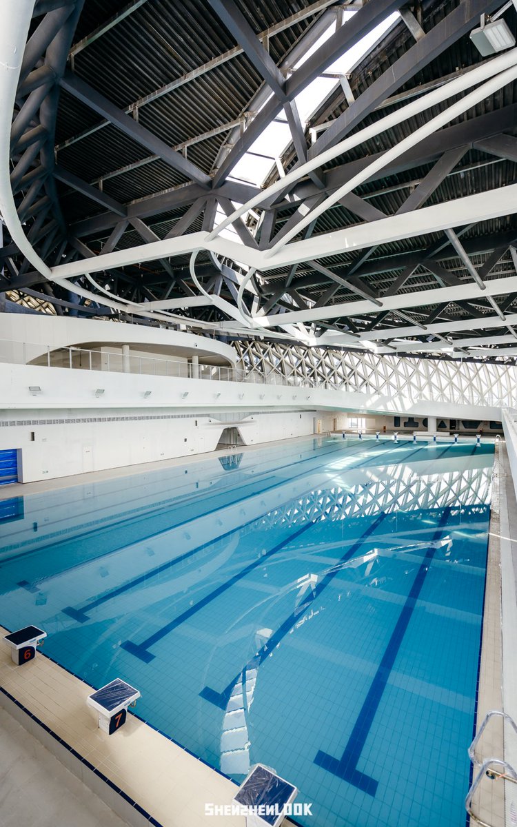 ShenzhenPages's tweet photo. Shenzhen's Dapeng Sports Center in Baguang area resembles a giant ark resting by the sea. The new landmark comprises a cultural center, a sports center, and Baguang Central Park, all interconnected by canyon‑style corridors.

Currently, the badminton courts and basketball courts at the venue are open to the public. The swimming pool is not yet accessible.

Once fully operational, the cultural center will feature a 1,200‑seat grand theater equipped with a lift stage and immersive audio, a 406‑seat black‑box theater, a library with a collection of 300,000 books, and an exhibition and event space. Floor‑to‑ceiling windows throughout the venue face Baguang Bay.

Source: Amazing Shenzhen