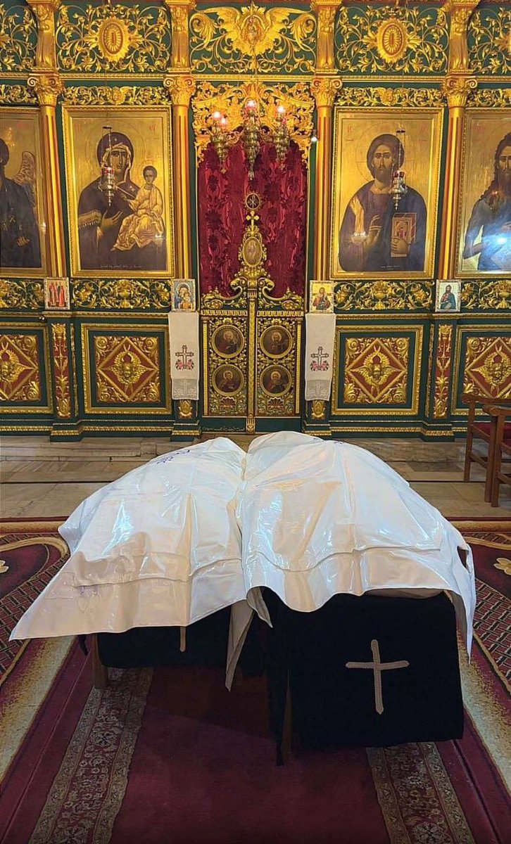 QudsNen's tweet photo. The Greek Orthodox Church in Gaza begins the funeral rites for Maisa Daoud and her daughter Maria, who were killed while asleep in their apartment in an Israeli strike last night, west of Gaza City. https://t.co/JdaJUCCUsc