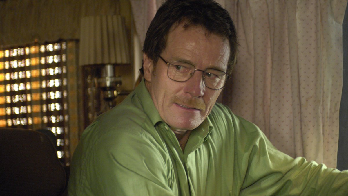 EmmyHood01's tweet photo. One thing Breaking Bad did ridiculously well was using Walter White’s clothes to quietly tell you where his character was going.

Early Walt was wearing those harmless beige and green dad clothes.

The deeper he became Heisenberg, the darker his wardrobe became too.

Man’s shirts were experiencing character development. 😭