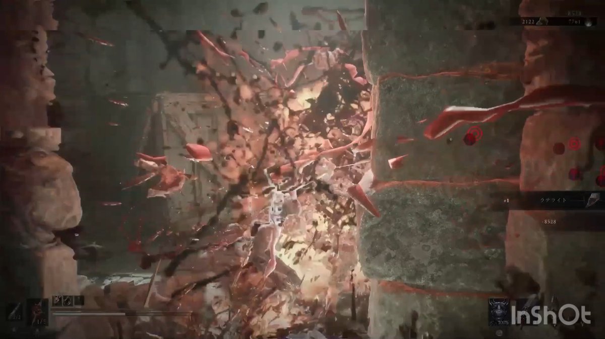 A chaotic video game screenshot showing an explosion with red fragments flying outward, with Japanese text "クシナライト" and the watermark "InShOt" in the corner.