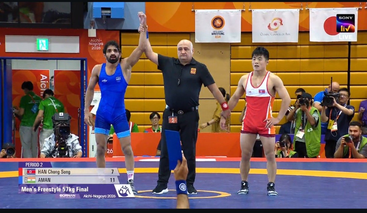 monster_zero123's tweet photo. Aman Sehrawat beats accidental World Champion Chongsong Han🇰🇵 11-7 to claim the Asian Games gold in men's 57 kg! 

Give gold medal to Han for faking injury. https://t.co/TbOwLjdFBW