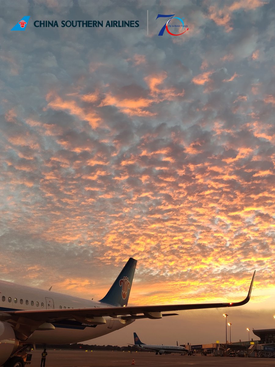 CSAIRGlobal's tweet photo. A sky full of layered orange clouds. A China Southern Airlines jet is parked quietly below. Have a beautiful evening!✈️🌅
#CSAir #FlyWithCSAir https://t.co/CLa6ZtAZEg