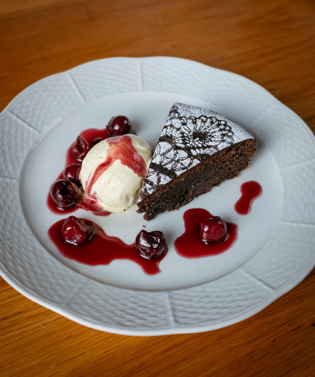 Leon_F_T's tweet photo. Torta Caprese (flourless chocolate-almond cake) with Vanilla Ice Cream and Sour Cherries https://t.co/6cTLRmysNH