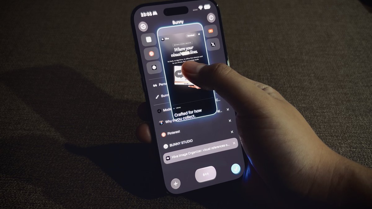 A hand holds a smartphone displaying the "Bunny Studio" app interface, showing AI-generated previews and integration options for Pinterest and Hive, with the time 23:08 visible on the screen.
