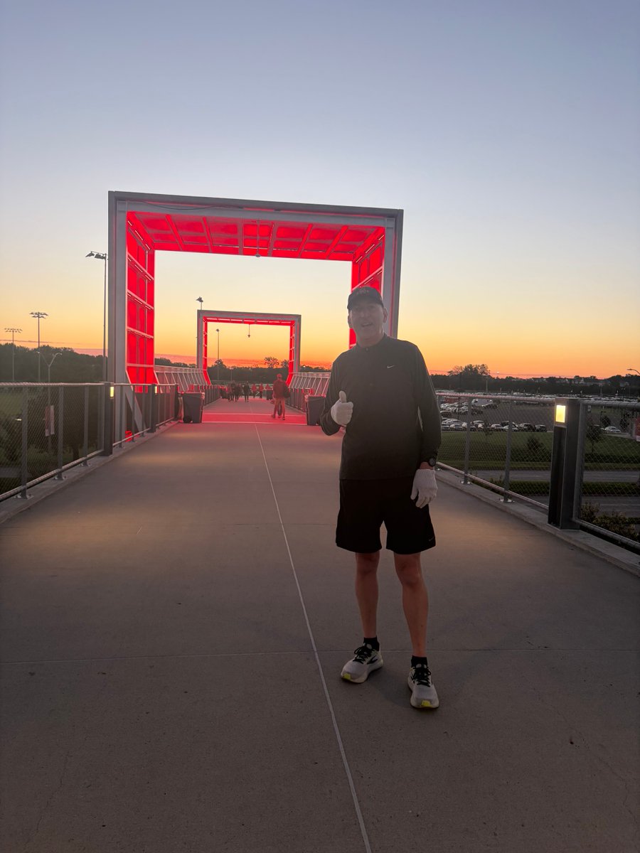 IASTATEAD's tweet photo. My last game day run as AD. What a beautiful sunrise coming up over the bridge. Thank you to Ethan Trometer of Ames for stopping to take my picture. Go Cyclones! https://t.co/9lCUtFWG27