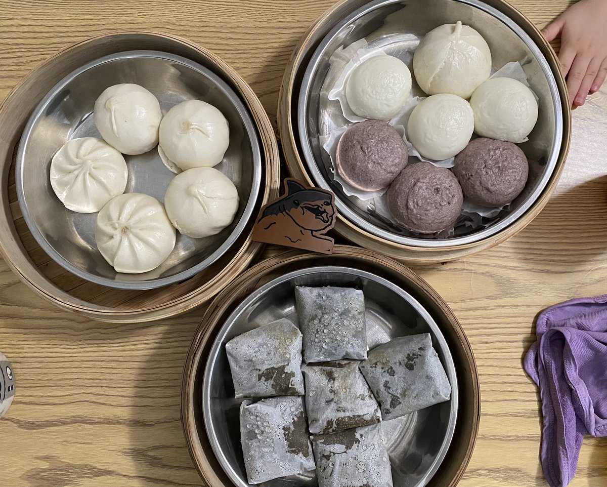 spaceshark23's tweet photo. Shork brekkie. Bottom dish is rice dumplings still in parchment paper so they don’t stick to the plate https://t.co/bQyfI3tXhT
