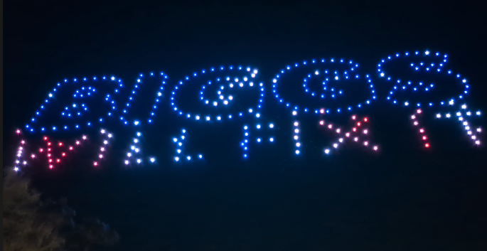 CoffinItUp's tweet photo. So, last night I was just hanging out in Scottsdale with a few friends and an "average" Scottsdale crowd when we were attacked by these lights in the night sky! The display (300 drones...) was rather impressive until everyone realized it was a Biggs campaign stunt and to a man/woman started LAUGHING AT HIM. It was really a joy to behold!
We went and found the drone operators, and they were nice enough to quote us on what a show like this would cost...$50K/pop. The campaign is doing five shows. Quarter million to get laughed at. Nice work, Andy!!!