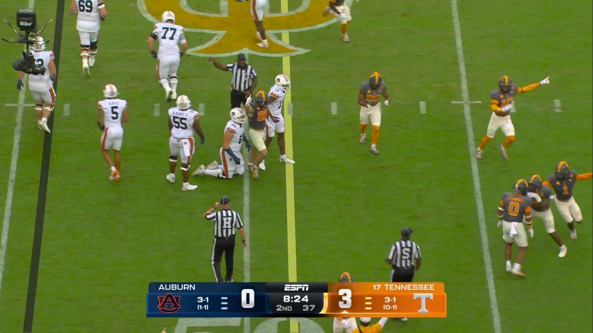 The image shows a college football game between Auburn and Tennessee on ESPN, with Tennessee leading 3-0 at 8:24 in the 2nd quarter, and players from both teams gathering around the spot of a fumble. This relates to the post about the Vols forcing and recovering a fumble, as the players and referees appear to be reacting to that key turnover play.