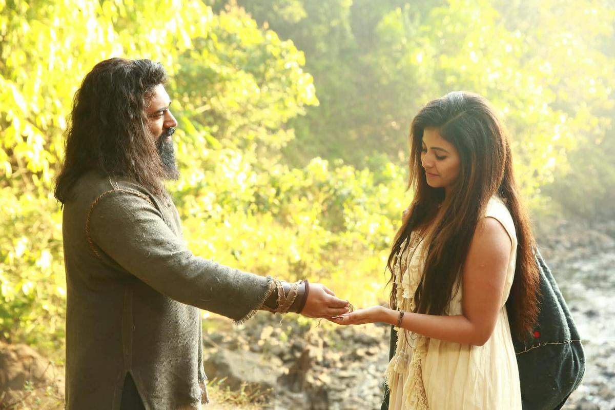 sudhirsrinivasn's tweet photo. Mannnyyyy, mannnyyy thoughts on #YezhuKadalYezhuMalai (possible spoilers)
____

There is a moment in Yezhu Kadal Yezhu Malai when a rat is given CPR. Yeah, you read this right. Someone presses its tiny chest, desperately trying to get it to breathe again. You see its tender chest compressing, expanding... In another film, this would be a ridiculous visual, a joke perhaps. In this film, it doesn’t. Because somehow director Ram establishes that its life matters. It's hard to pin this film to a single idea, but if I had to, as a challenge, I might say: Love is eternal and so broad that it would be a pity to restrict it to a family, to a species, to a specific time even.

Soori’s character is the project this film takes on. This frightened, very ordinary man is desperate to return to his family after being away for a long time. This isn't just Soori trying to create humour out of fear, though he certainly manages that from time to time... like when Nivin breaks into pure Tamil and Soori, without conviction, goes: “Vera level, bro”. But underneath these situational humour attempts is a serious man driven by serious emotional needs. He has a son. He has a family. He wants to survive. Isn't that the most primal of all instincts for any living form?

Most films would turn this into a heroic quality. This one asks questions of it. What does it mean to care only about those who belong to us? Why is your child more important than somebody else’s? Why is a human life more valuable than another life form? And in any case, what does it even mean to own something in the first place? Perhaps that's why Soori’s belongings slowly get stripped away from him. It begins with things and ends with a reinterpretation of fatherhood.

Perhaps this film's most beautiful challenge to the idea of ownership comes from children finding... new mothers. This happens to a human child. This happens to a rat child. To adopt is perhaps one of the purest challenges to the idea of biological ownership, no? This child isn't mine. It doesn't carry my gene. And yet, I choose to care for it. These are grand ideas, and yes, this is a film born out of a grand premise: An immortal man who's been living for more than 8,000 years is jolted awake by a mortal, a man who must feel like an infant to Nivin's character. Perhaps that's why this film itself begins as a fable being narrated to a child.

It's bizarre, strange, and anything can happen in this fable. I think that's why even AI-generated imagery, which has understandably bothered some, didn’t quite affect my immersion too much. Right from the first minute, it announces this artificial, storybook-like quality as you see artificial fireworks illuminate a train at night. I don't think Yezhu Kadal Yezhu Malai is asking: “Do you believe this happened?” Instead, it seems to be asking: “Will you stay with me while I narrate this strange story?"

And by now, I've come to see that Ram’s films are, be patient with them or not, unique experiences. They can be angry, tender, eccentric, philosophical, sentimental and funny, sometimes within the same stretch. In fact, after Parandhu Po and Yezhu Kadal Yezhu Malai, I wonder if his cinema is beginning to reflect a childlike way of looking at the world. They seem to be interested in returning us to wonder, in recovering a way of looking at the world before hierarchies were methodically planted in our heads. Before ideas were drummed in. Like what's important and unimportant. Like what's possible and impossible. Like what's mine and yours.

In this film, at some point, a child is dead... from starvation. There is something haunting about this. Perhaps Yezhu Kadal Yezhu Malai is also, in some abstract way, about the death of childhood and the attempt to reclaim it? Maybe that’s why a bedtime-story form feels so appropriate. You grow up and learn how the world works. And then perhaps, if you’re lucky, you spend some part of adulthood trying to recover everything this knowledge took away from you.

I think for that reason, a train is a pretty setting for such a story. Much of this film happens inside one, and yet, I never felt claustrophobic. I don’t remember Ram relying on aerial shots of the train to manufacture scale either. I remember thinking that the compartments felt airy, almost expansive, like an unusually empty train compartment really can. There is room to move, to fight, to chase. The sound design is pretty terrific work. I barely heard the chug of the train after a few minutes, and in fact, it got conspicuous only when it stopped. When Soori's character gets thrown out, suddenly you hear dangerous whooshes of wind. Suddenly, the outside feels frightening. These are small sensory choices, but effective ones.

There are beautiful images too. Fireworks reflected in glasses. Faces framed by train windows. But my favourite stretch of Yezhu Kadal Yezhu Malai comes later, near the waters of Rameswaram. There is a languidness to this portion that I enjoyed gazing at. The landscape feels dry. Life seems almost static. There are some men: different ages, different bodies, different faces. And then a woman arrives on a bicycle. And with the score, it really feels like life has entered the frame, and even the film.

Anjali’s character seems to have this effect on the film. There is an intriguing moment here involving a man whose gaze initially seems lustful, and what she does seems almost to purge him of it. Across Yezhu Kadal Yezhu Malai, I thought there seemed to be this idea of the feminine being associated with nurturing, renewal and the continuation of life. In this Rameswaram stretch, this quality becomes almost abstract. The woman on the bicycle isn’t simply the object of Nivin’s centuries-long desire. She feels, momentarily, like an elemental force entering this barren world.

But yes, there is a love story here as well. Yes, yet another idea. What does love even mean when you have lived for more than 8,000 years? Nivin’s character has seen enough of humankind to become deeply cynical and angry about all of us. He has presumably seen every variety of cruelty repeat itself. Civilisations have come and gone. Entire families have come and gone. And yet, strangely, this ancient man still remains almost impossibly hopeful about love, about her. He keeps looking. Perhaps the romantic idea here isn’t that love lasts forever. Is the film suggesting that longing lasts longer? Yezhu Kadal Yezhu Malai isn't the kind of film to spell out answers to such questions.

It's a hopeful world in that sense, but one in which cruelty unfurls. A child dies. A rat dies. Death happens. Separation happens: to rats, and humans. But so long as somebody chooses to nurture another life, something, in some form, continues. And that's why I think of that rat receiving CPR. We could discuss what it means, but I'm not sure I'd be able to tell you exactly what I felt about it. In fact, if you asked me what Yezhu Kadal Yezhu Malai is about, I might  struggle to explain it. There is an immortal man, a frightened man trying to return to his family, a woman on a bicycle, a dead child, a rat, trains, dreams, memories, desire, motherhood, cruelty and kindness. I'd go on. Some ideas connect, some float around. But you know what? It's all right.

In between all our solving, all our explaining, here's a film that seems to invite us to get on a train and just travel along,. Sometimes, it's nice just to listen and look out of the window.
