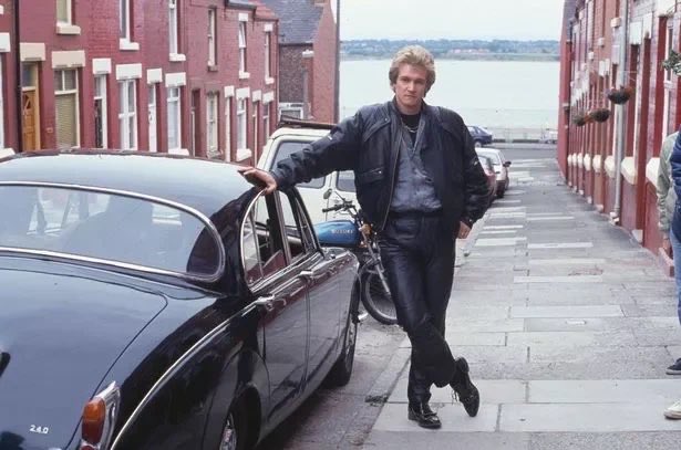 Tommy_1972's tweet photo. Another great goal from Anthony Gordon. Here he is pictured last week outside of his Nan’s house in the Dingle showing off his new Jaguar supplied by Georgesons Liverpool https://t.co/ETzeYquKIE