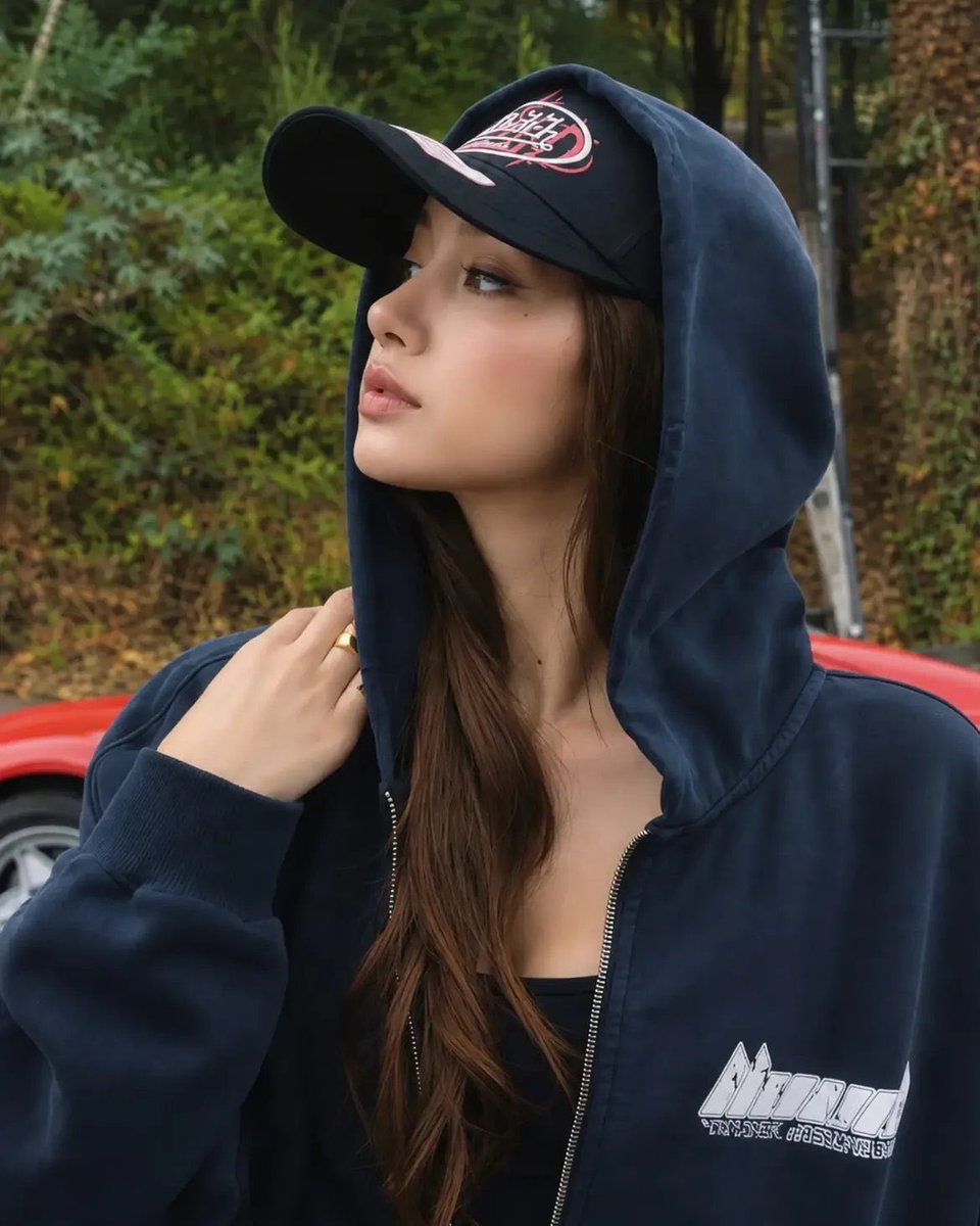 popbuzzz_'s tweet photo. BLACKPINK’s Lisa modeling her LLOUD brand’s capsule collection with Von Dutch Hollywood, featuring trucker caps and zip-up hoodies in black, navy, and pink.

The collaboration, Von Dutch Hollywood’s first-ever, debuts exclusively at ComplexCon in Los Angeles on October 3-4, 2026, with items like tees, hoodies, and accessories.

Lisa looking cool in casual streetwear looks with the brands’ logos, blending K-pop influence and retro California aesthetics against urban and nature backdrops.