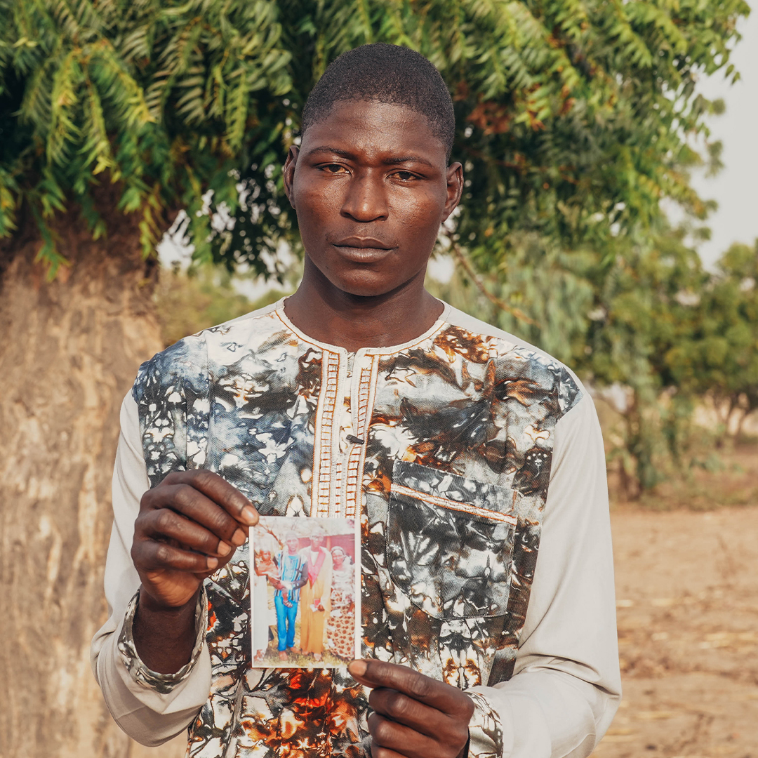 OpenDoorsUK's tweet photo. Will you give, pray and speak up to honour the memory of the martyrs, and for those who loved them? 

In this picture, Pastor Michée holds a photo of his father, who was killed in an attack by Islamist militants in Burkina Faso. 

Thousands of Christians in sub-Saharan Africa are killed every year as escalating violence rips through Christian communities. 

Believers in the region, like Pastor Michée, are desperate for the killings to stop and the healing to start – and here are three things you can do: 

1. Give financially to support initiatives like trauma care
2. Speak up by adding your voice to the Arise Africa petition
3. Pray by downloading our month of prayer. 

Get involved: https://t.co/e56QDWkRwn