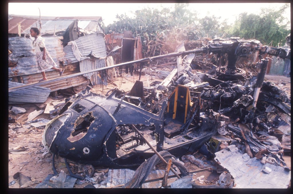 EchoesofWarYT's tweet photo. Oct 3, 1993: Task Force Ranger flew into Mogadishu on a mission that was supposed to take about an hour. It lasted all night, and it changed American foreign policy for a decade.

Somalia had collapsed into civil war in 1991. Warlords fought over the capital and used food as a weapon, and a famine killed hundreds of thousands of people. In December 1992 President George H.W. Bush sent about 25,000 American troops to protect food shipments. It worked. The starvation eased.

In 1993 the mission was handed to the United Nations, and it grew into something bigger: disarming the militias and rebuilding the country. The most powerful warlord in Mogadishu, Mohamed Farrah Aidid, saw the UN as an enemy. In June his militia ambushed and killed 24 Pakistani peacekeepers. The UN put a bounty on him.

In August the US sent Task Force Ranger: Army Rangers, Delta Force operators, and the helicopter pilots of the 160th Special Operations Aviation Regiment, the Night Stalkers. Their job was to capture Aidid and his top people. They ran six raids. None of them got Aidid.

On the afternoon of Oct 3, word came that two of his top lieutenants were meeting near the Olympic Hotel, in the heart of Aidid's territory near the Bakara Market. About 160 men went in. Delta assaulted the building while Rangers fast-roped from Black Hawks to seal off the block. A ground convoy of Humvees and trucks came to haul everyone out.

The raid itself went fine. They captured around two dozen Somalis, including both targets. But one young Ranger missed the rope and fell about 70 feet to the street, and the whole neighborhood was already coming out with rifles and RPGs.

Then an RPG hit a Black Hawk, Super 61, and it went down in a narrow alley a few blocks away. Both pilots were killed. Rangers and Delta operators on foot ran to the crash site and set up a perimeter around the wreck. The convoy tried to reach them and got lost in the maze of streets, taking fire at every turn, with wounded and dead piling up in the vehicles.

About 20 minutes later a second Black Hawk, Super 64, flown by Mike Durant, was hit and went down about a mile away. There was no one close enough to get there.

Two Delta snipers circling overhead, Master Sgt. Gary Gordon and Sgt. 1st Class Randy Shughart, asked to be dropped at the second crash site to protect the crew. They were told no. They asked again. They were told no again. They asked a third time and were finally put down. They pulled Durant out of the wreckage and fought off the crowd until they ran out of ammunition and were killed. Durant was beaten and taken prisoner.

Gordon and Shughart were awarded the Medal of Honor, the first since Vietnam.

At the first crash site, about 90 men held out through the night in a few buildings, short on water, ammunition, and night vision, with wounded men they couldn't evacuate. They wouldn't leave without the body of the pilot pinned in the wreckage. Little Bird helicopters made gun runs over their heads until morning.

A relief force from the 10th Mountain Division finally reached them around 2 a.m. They came in Pakistani tanks and Malaysian armored personnel carriers because the Americans didn't have their own armor in Somalia. A request for tanks had been turned down weeks earlier in Washington.

There wasn't enough room in the vehicles for everyone. At first light some of the Rangers and Delta operators had to run out on foot alongside the convoy under fire. That route became known as the Mogadishu Mile.

Eighteen Americans were killed and 73 wounded. A Malaysian soldier was killed. Somali deaths are estimated in the hundreds, possibly over a thousand.

Back home, Americans saw footage of the bodies of US soldiers being dragged through the streets of Mogadishu, and video of a battered Mike Durant in captivity. Durant was released after 11 days. Within days President Clinton announced American troops would be out of Somalia by March 1994. The Secretary of Defense resigned that December.

The fallout went far beyond Somalia. In 1994, when genocide broke out in Rwanda and about 800,000 people were killed in roughly 100 days, Washington refused to intervene. Mogadishu was a big reason why. Osama bin Laden later pointed to Somalia as proof that America would pull out if it took enough casualties.

Mark Bowden told the story in Black Hawk Down, and most Americans know the battle by that name now. To the men who were there, it's still just the Battle of Mogadishu.
