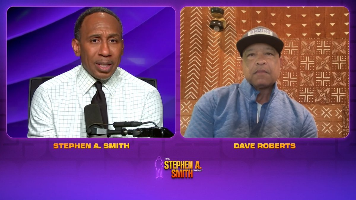 The image shows a split-screen from "The Stephen A. Smith Show" featuring host Stephen A. Smith on the left and Dodgers manager Dave Roberts wearing a "Bruins" cap on the right, in a discussion tied to the post's question about whether anyone can prevent the Dodgers from achieving a three-peat championship.