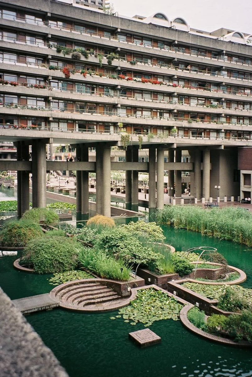 SciFiArchives's tweet photo. The Barbican Estate is brutalism at its most beautiful, where monumental concrete meets nature. https://t.co/i0YXX7a1YK