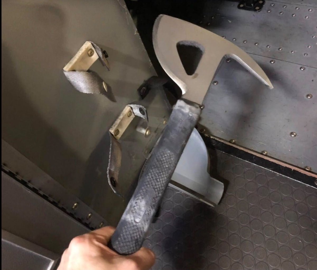 OmerGhazi2's tweet photo. UAE authorities have confirmed that this is what the terrorist used to attack Captain Smit Macchhar. 

Those who were asking where did he get the knife or any weapon from, this "crash axe" is a mandatory tool kept inside cockpit to break through metal or glass during emergencies. 

Imagine being attacked with this in a small space like a cockpit!

Apparently his plan was to kill the pilot over Jordanian airspace and then crash the plane somewhere in Israel.

Captain Smit is lucky to be alive. Respect increased for him after looking at this weapon.