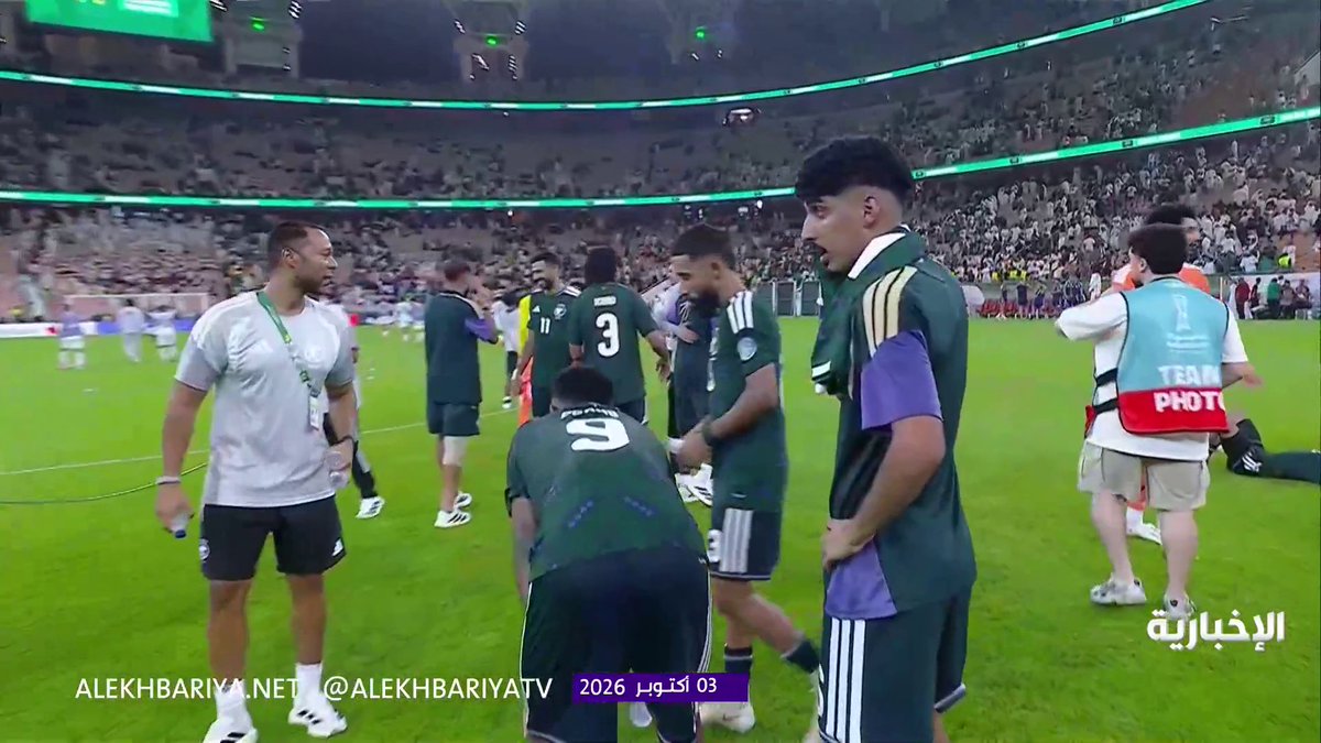 A screenshot from Alekhbariya TV dated October 3, 2026, showing soccer players in green jerseys on a field after a match.