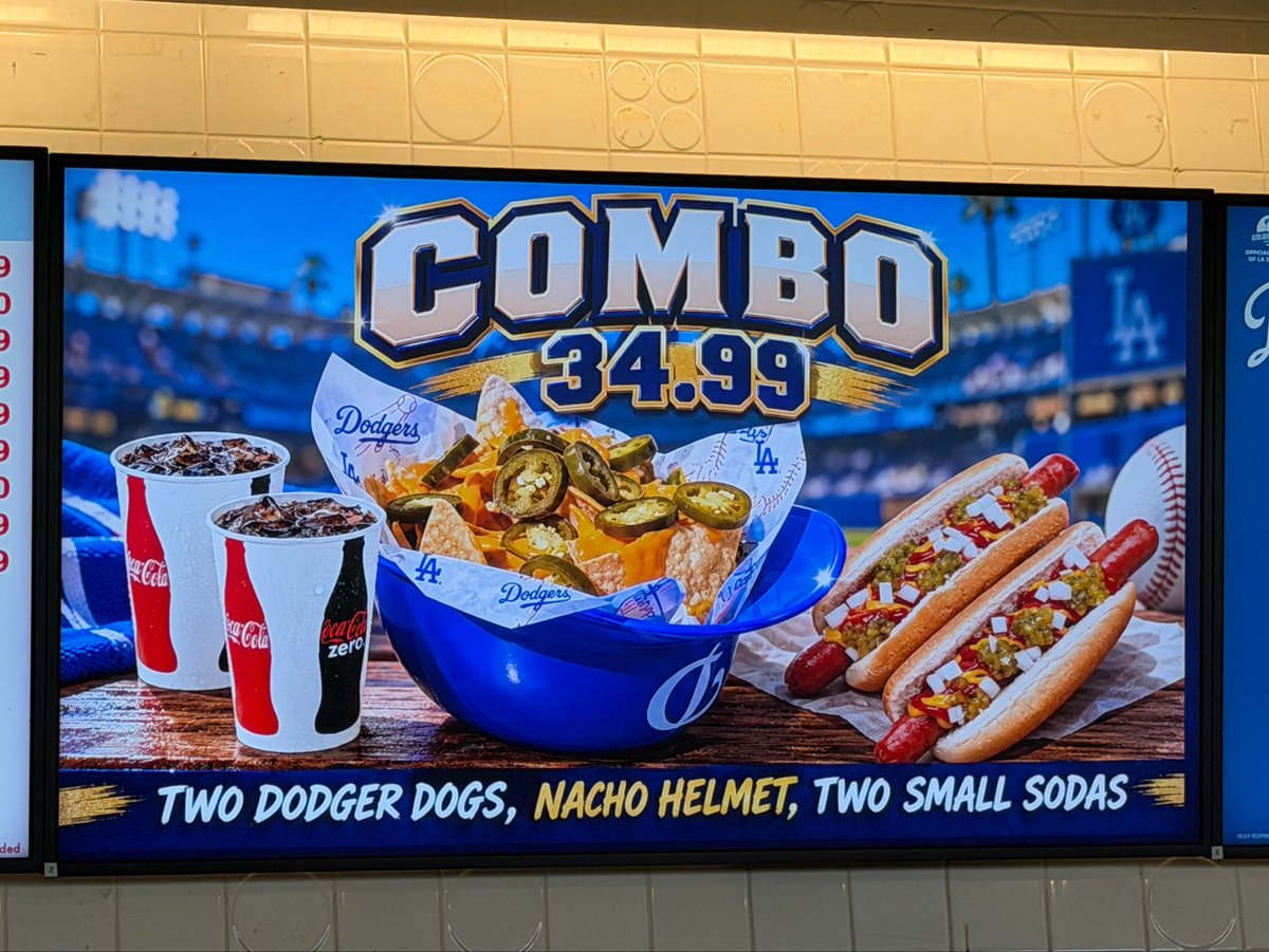 ArashMarkazi's tweet photo. Some of the meal deals at Dodger Stadium: 

Wing Sampler: $89.99
Hello Kitty Collector’s Popcorn: $59.99
Hot Dog Combo: $59.99
Nacho Combo: $34.99 https://t.co/ms5CDsuWgY