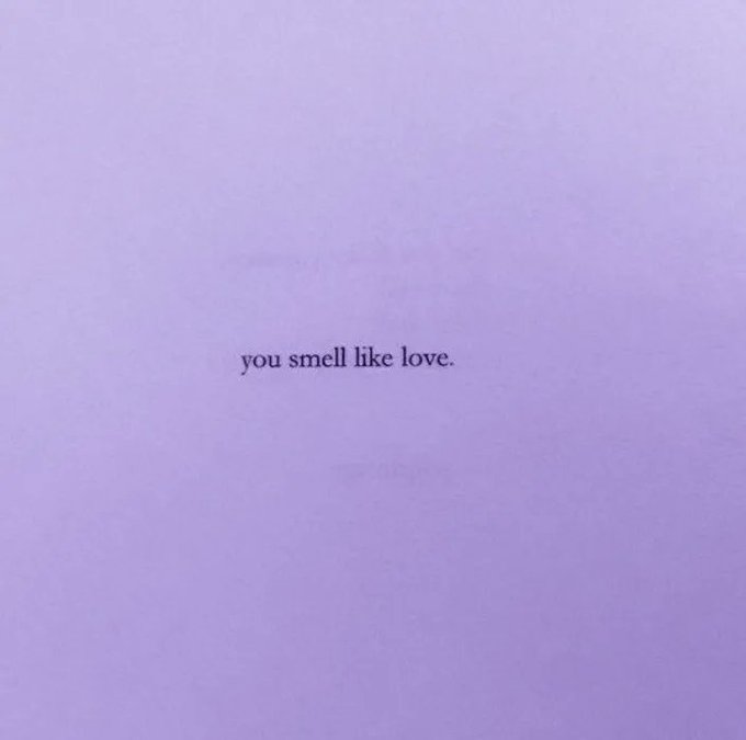 The image features a minimalist lavender background with the text "you smell like love." printed in lowercase letters in the center. This appears to be a card or note from the hexorcism shop received as a Throne wishlist gift, with the message serving as a sweet, sentimental touch to accompany the delivery.