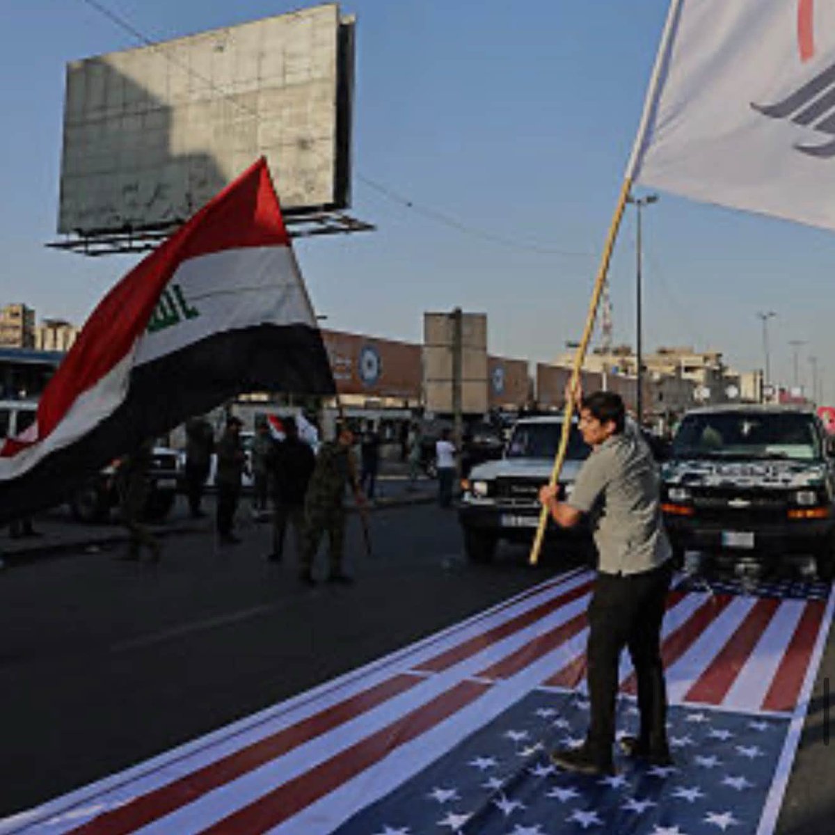 eqanbar's tweet photo. Iran’s proxy militias in Iraq are celebrating the U.S. withdrawal by desecrating the American flag!

This is just the beginning. Next, they will launch attacks against the United States and its allies from Iraqi territory, a massive serback for President Trump and the United States!

Whichever “genius” convinced President Trump to embrace this debacle must and should be held accountable by the President himself!